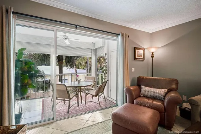 a work room with furniture and a large window