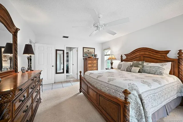 a bedroom with a bed and furniture