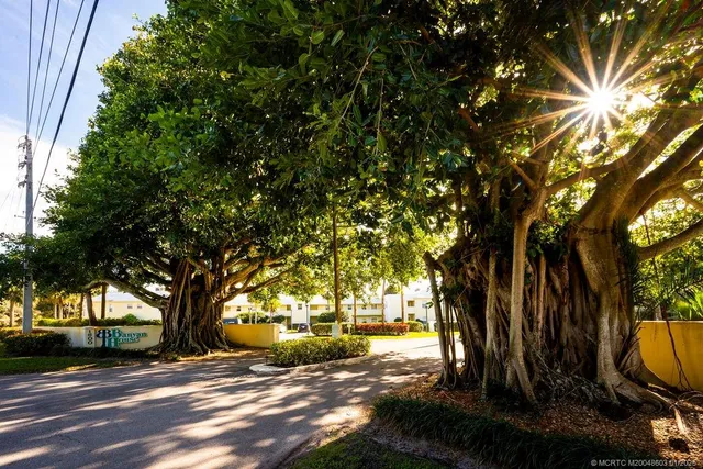 a view of a lake with houses in the back
