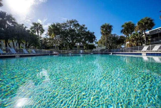 a view of a swimming pool with a patio