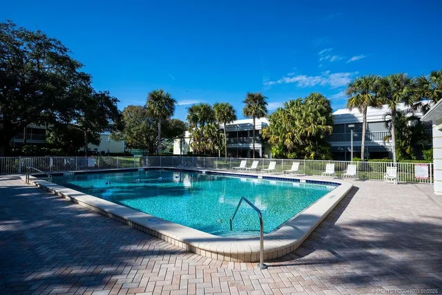 a view of a swimming pool with a patio