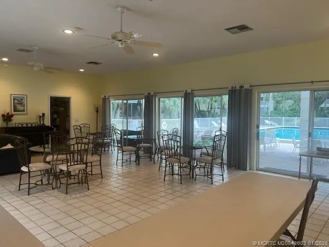 a view of a dining room with furniture window and outside view