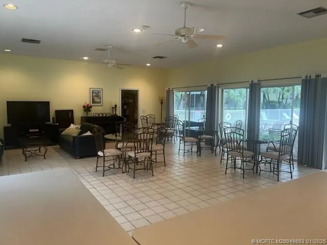 a view of a dining room with furniture window and outside view