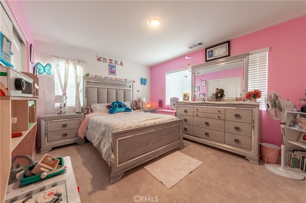 27283 Chase Road Menifee, CA 92584 - Photo 12 of 16 a bed room with a bed window and a dresser