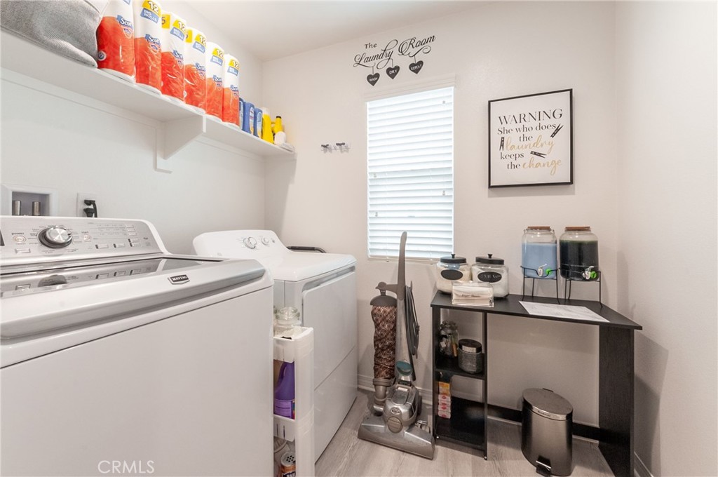 27283 Chase Road Menifee, CA 92584 - Photo 14 of 16 a utility room with dryer and washer