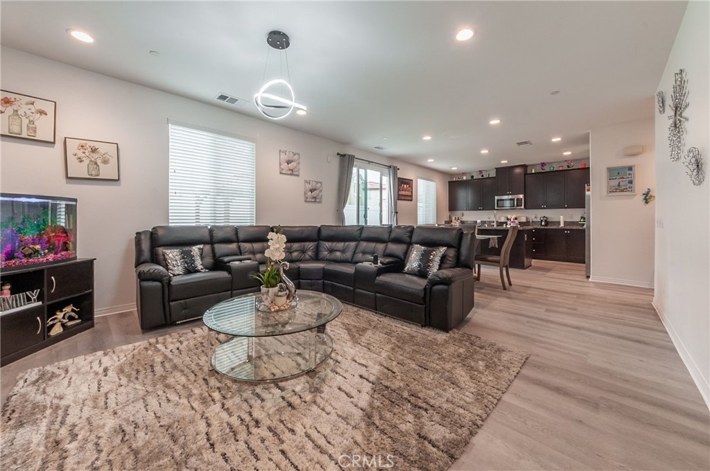 27283 Chase Road Menifee, CA 92584 - Photo 5 of 16 a living room with furniture and kitchen view