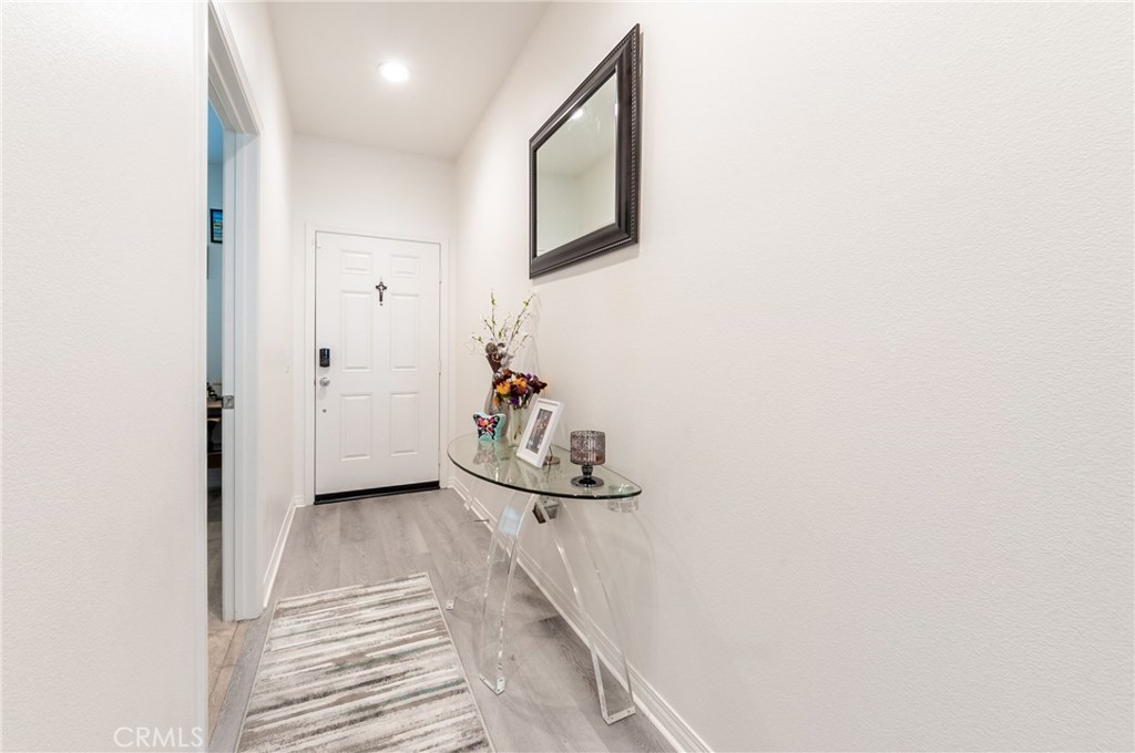 27283 Chase Road Menifee, CA 92584 - Photo 6 of 16 a view of a hallway with front door