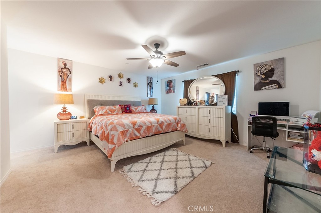 27283 Chase Road Menifee, CA 92584 - Photo 9 of 16 a bedroom with bed and window