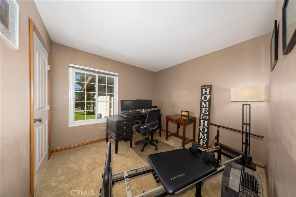 10514 Cameo Court Riverside, CA 92505 - Photo 14 of 30 a view of a workspace with furniture and a window