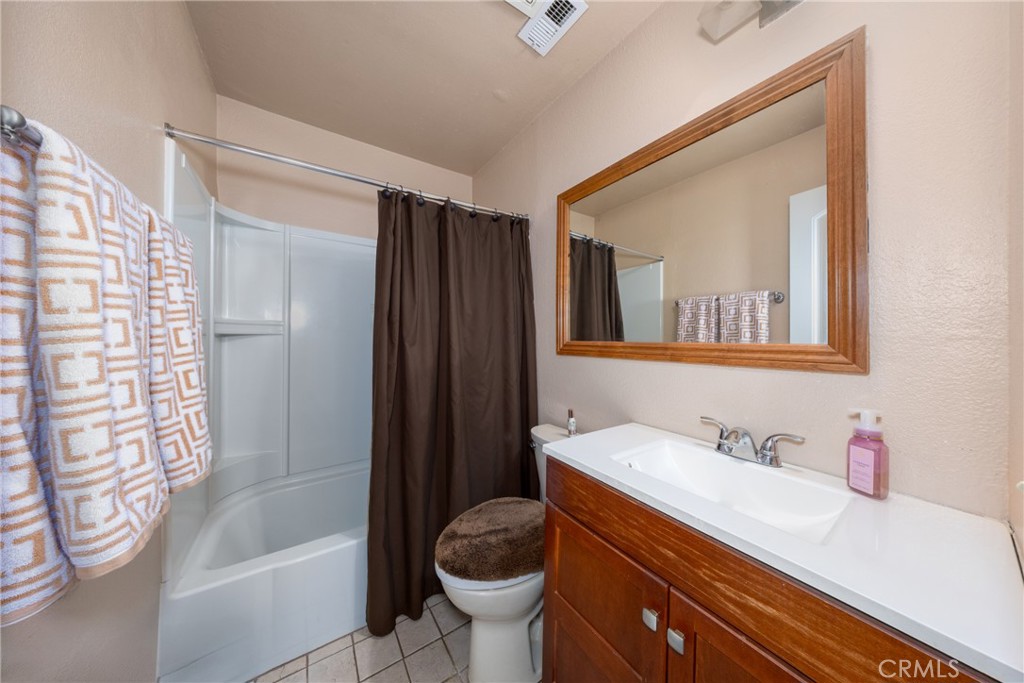 10514 Cameo Court Riverside, CA 92505 - Photo 18 of 30 a bathroom with a sink a toilet and shower