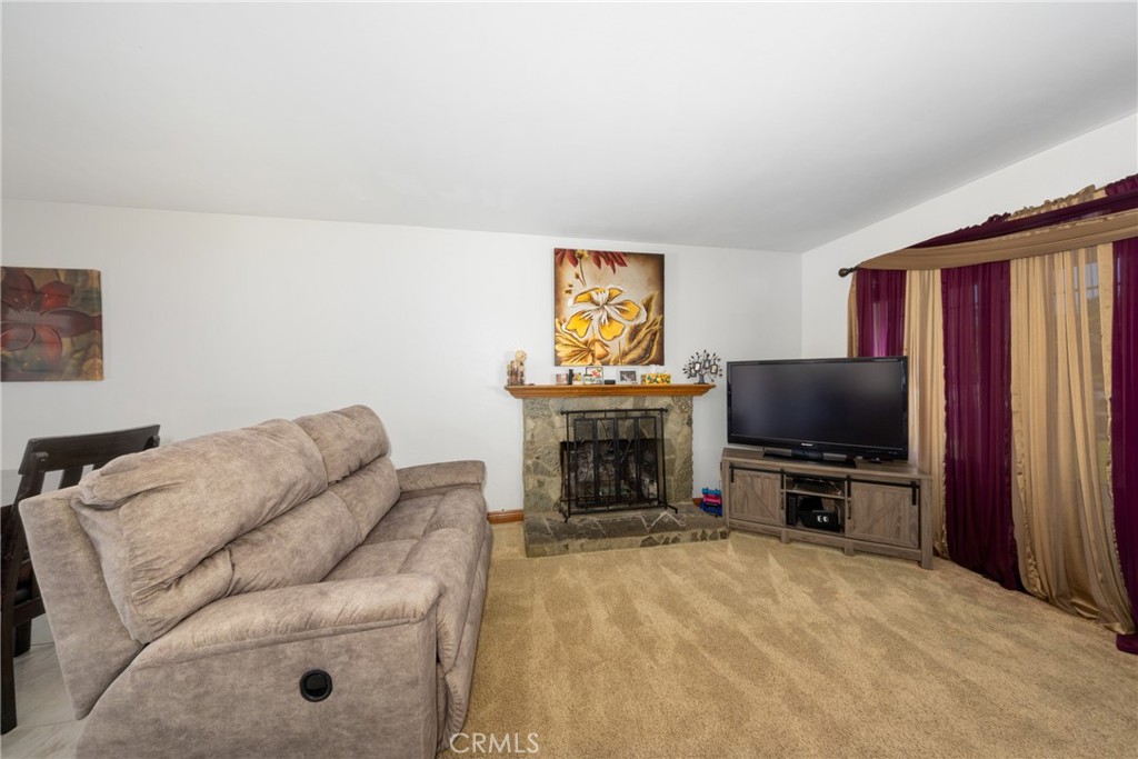 10514 Cameo Court Riverside, CA 92505 - Photo 7 of 30 a living room with furniture and a flat screen tv