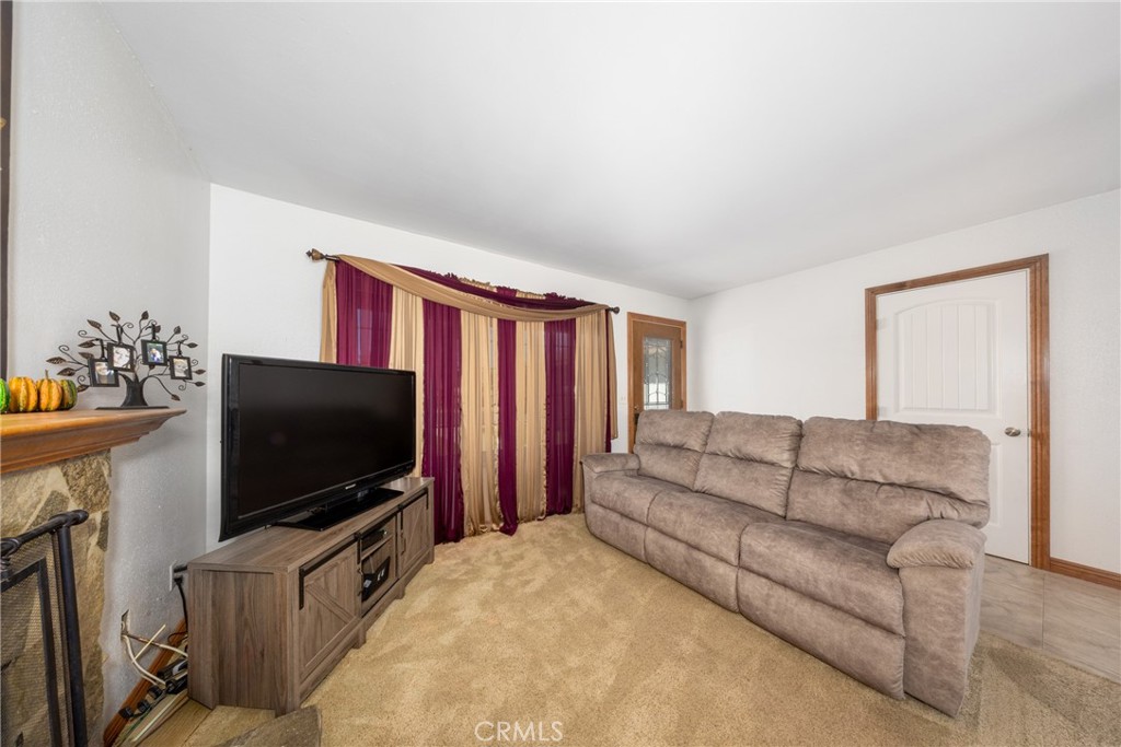 10514 Cameo Court Riverside, CA 92505 - Photo 8 of 30 a living room with furniture and a flat screen tv