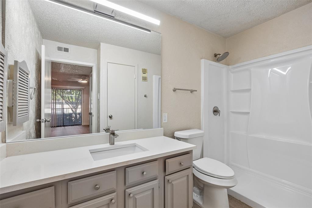 11480 Audelia Road, Unit 136 Dallas, TX 75243 - Photo 15 of 29 Bathroom vanity with a rectangular undermount sink and a light-toned countertop
