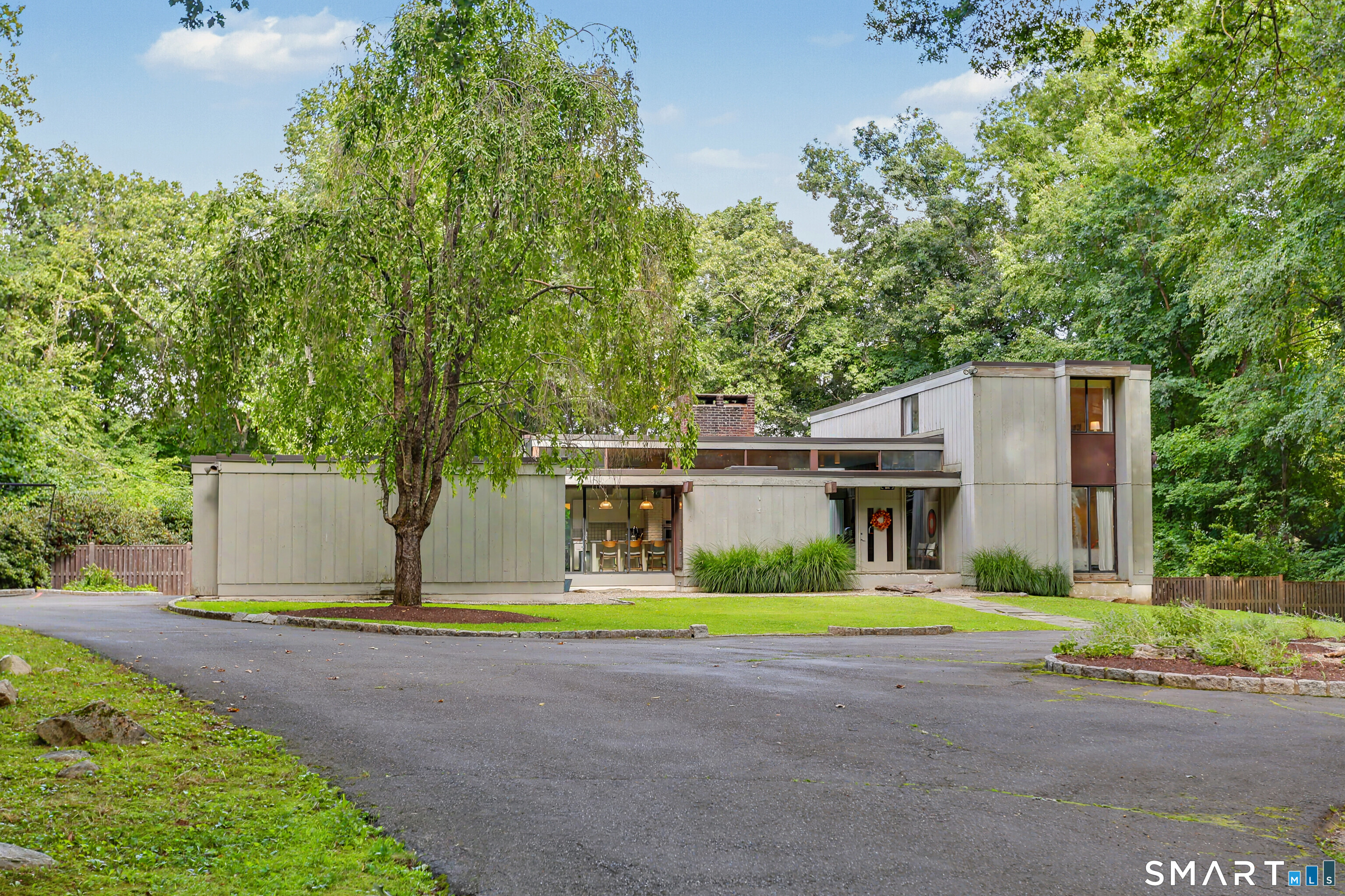 9 Autumn Ridge Road Weston, CT 06883 - Photo 2 of 40 The house is set down a long driveway at the end of a peaceful cul-de-sac.