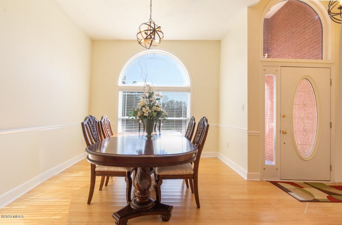 132 Brook Road Barnesville, GA 30204 - Photo 3 of 33 a view of a dining room with furniture window and wooden floor
