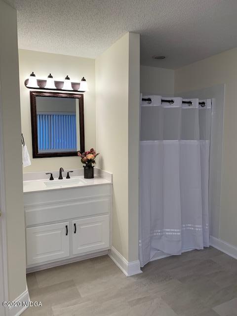 132 Brook Road Barnesville, GA 30204 - Photo 21 of 33 a bathroom with a sink and mirror