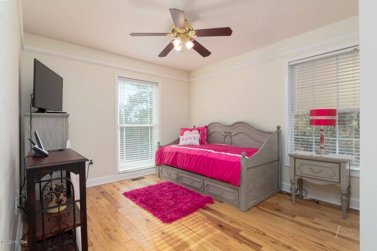 132 Brook Road Barnesville, GA 30204 - Photo 26 of 33 a living room with furniture a flat screen tv and a dresser
