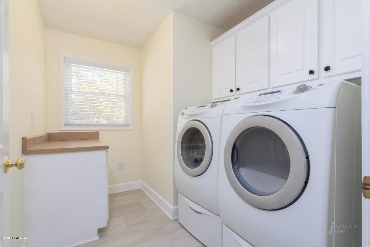 132 Brook Road Barnesville, GA 30204 - Photo 28 of 33 a view of a hallway with washer and dryer