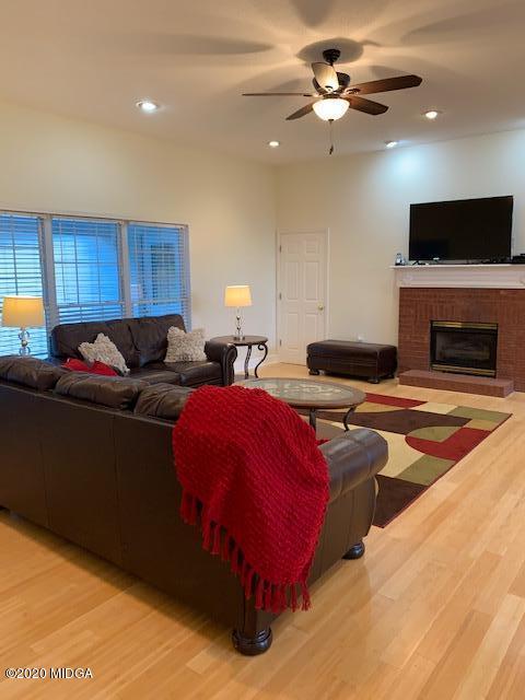 132 Brook Road Barnesville, GA 30204 - Photo 8 of 33 a living room with furniture a fireplace and a flat screen tv