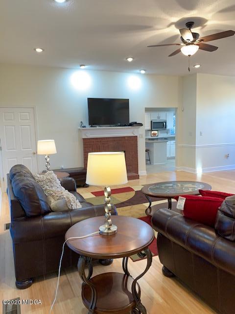 132 Brook Road Barnesville, GA 30204 - Photo 9 of 33 a living room with furniture and a flat screen tv