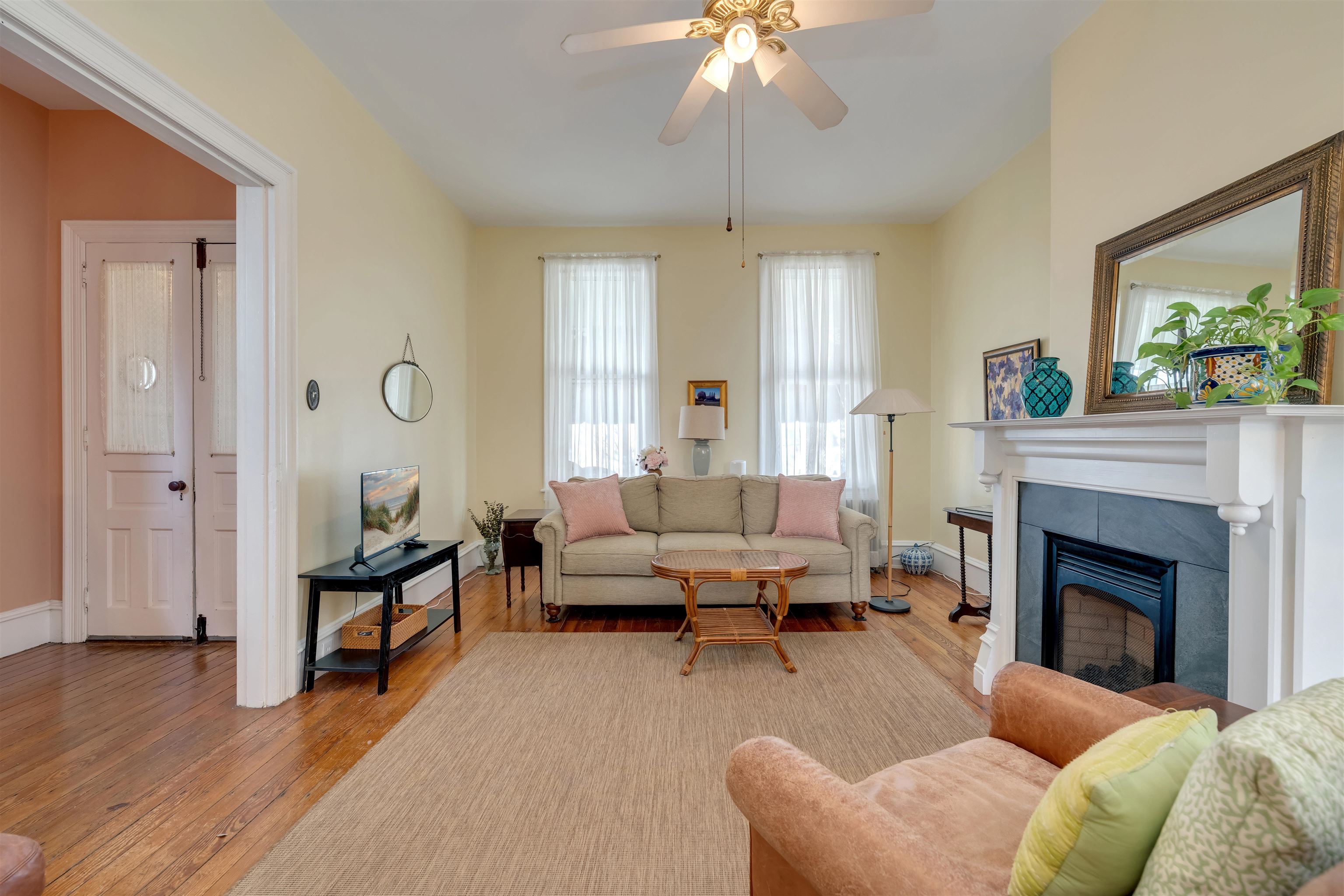 130 Decatur Street Cape May, NJ 08204 - Photo 11 of 50 a living room with furniture and a fireplace