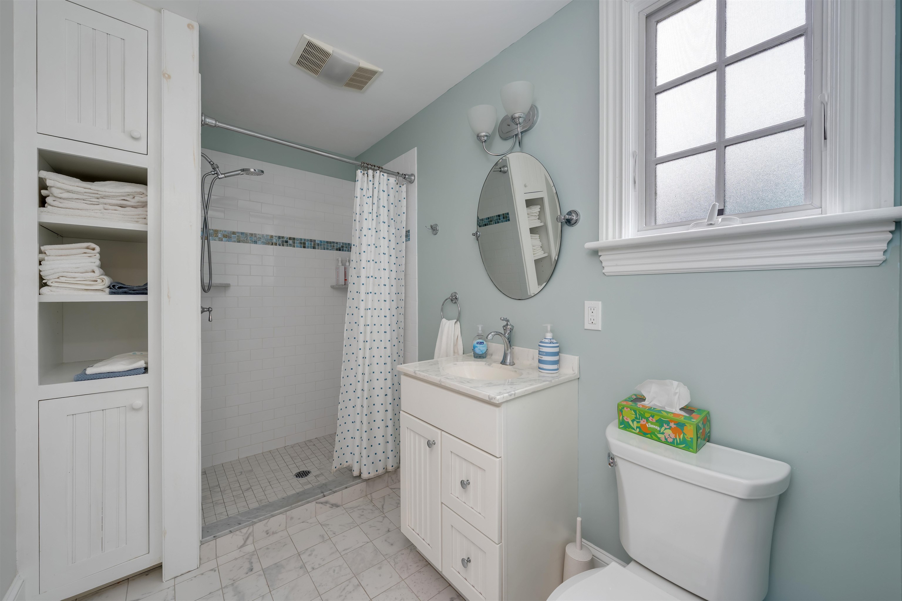 130 Decatur Street Cape May, NJ 08204 - Photo 24 of 50 a bathroom with a sink toilet and a mirror