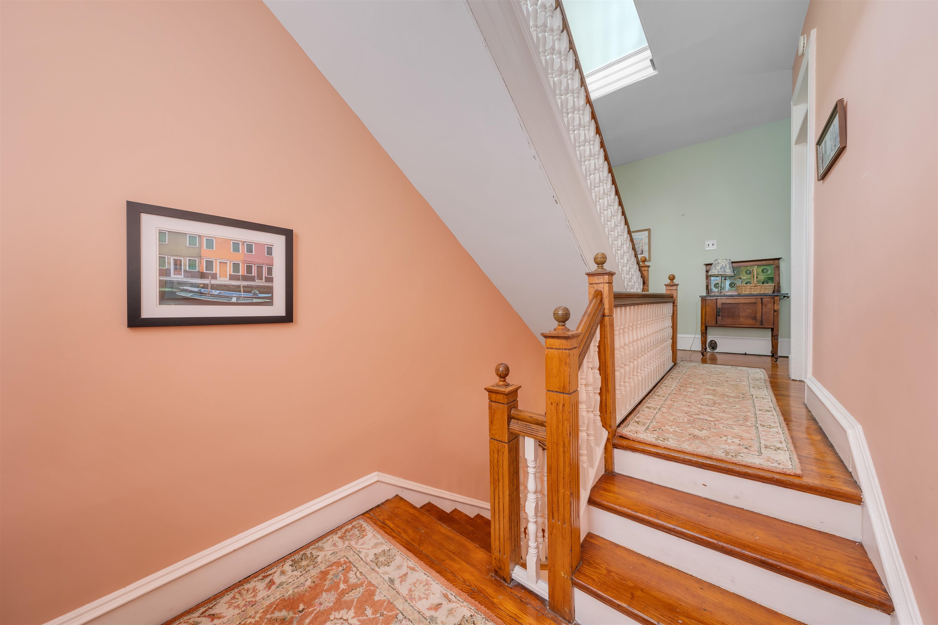 130 Decatur Street Cape May, NJ 08204 - Photo 27 of 50 a view of a hallway with wooden floor and staircase