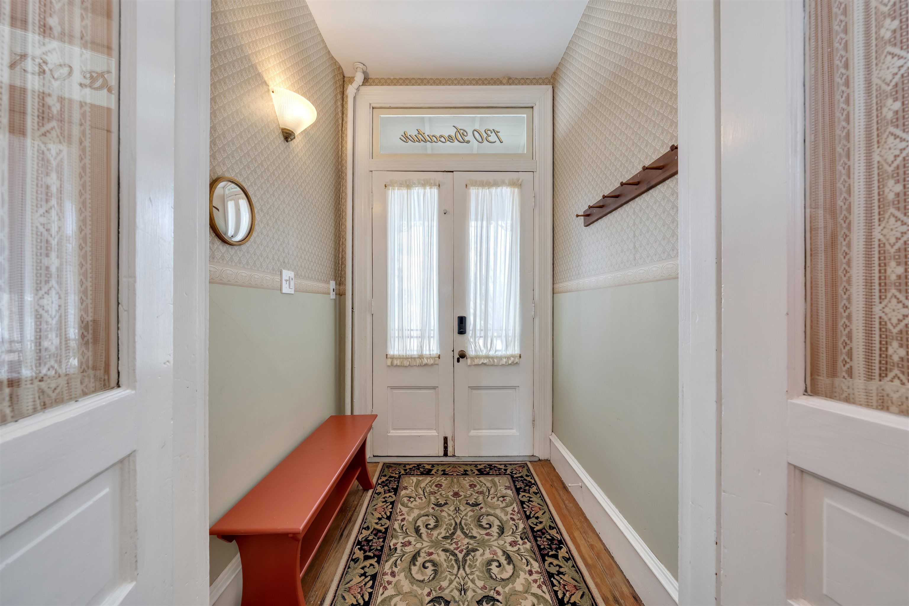 130 Decatur Street Cape May, NJ 08204 - Photo 6 of 50 a view of a hallway with windows and wooden floor
