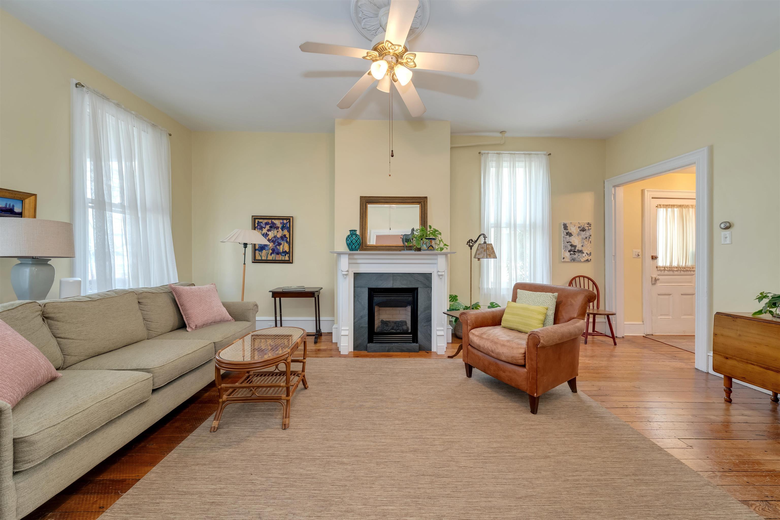 130 Decatur Street Cape May, NJ 08204 - Photo 8 of 50 a living room with furniture and a fireplace