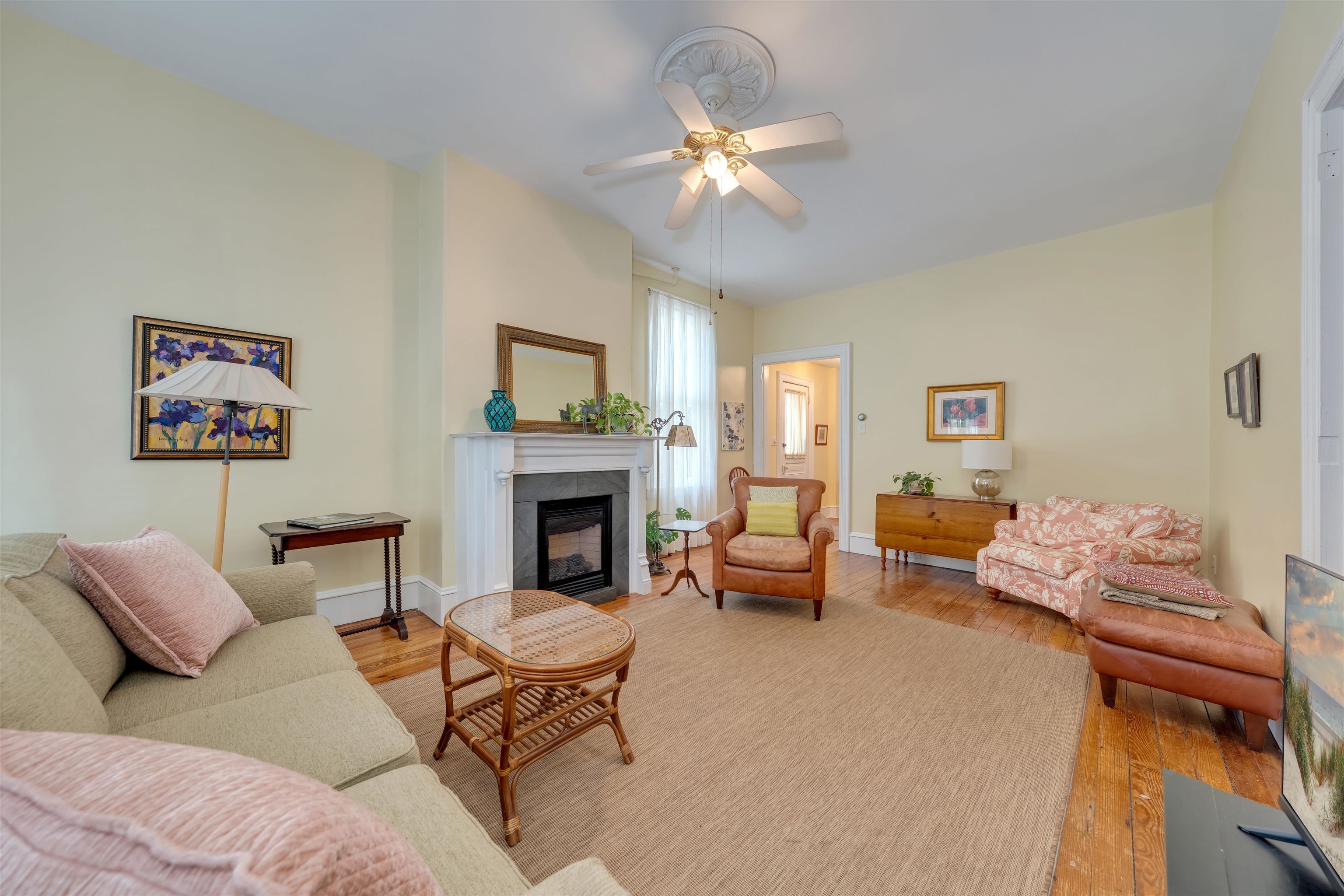 130 Decatur Street Cape May, NJ 08204 - Photo 10 of 50 a living room with furniture and a fireplace
