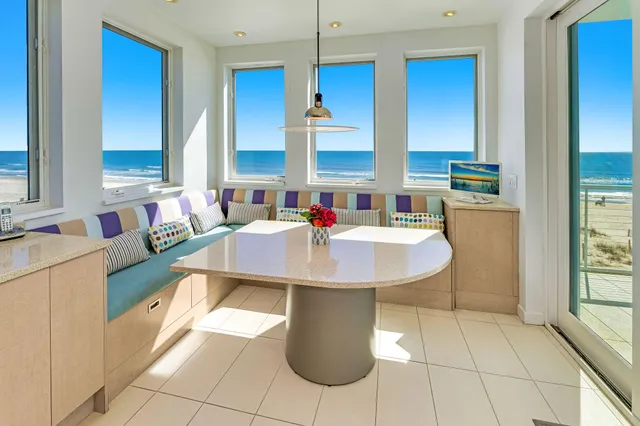 a large white kitchen with a large window