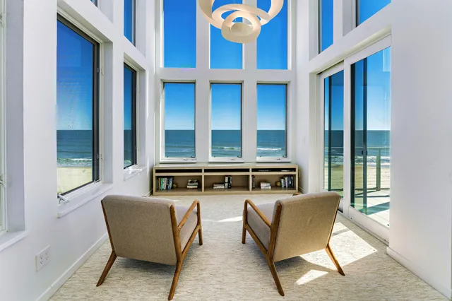 a large kitchen with a sink and stainless steel appliances