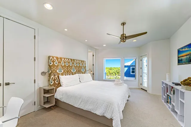 a bathroom with a granite countertop sink a toilet and a mirror