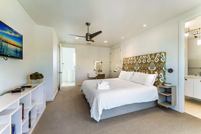 a bathroom with a sink mirror vanity and toilet