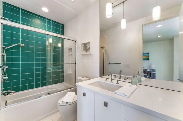 a spacious bedroom with a large bed and a large window