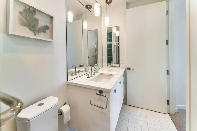 a view of a bedroom with furniture and window