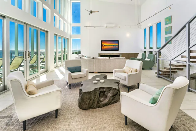 a large dining hall with stainless steel appliances kitchen island granite countertop a large counter top and sink