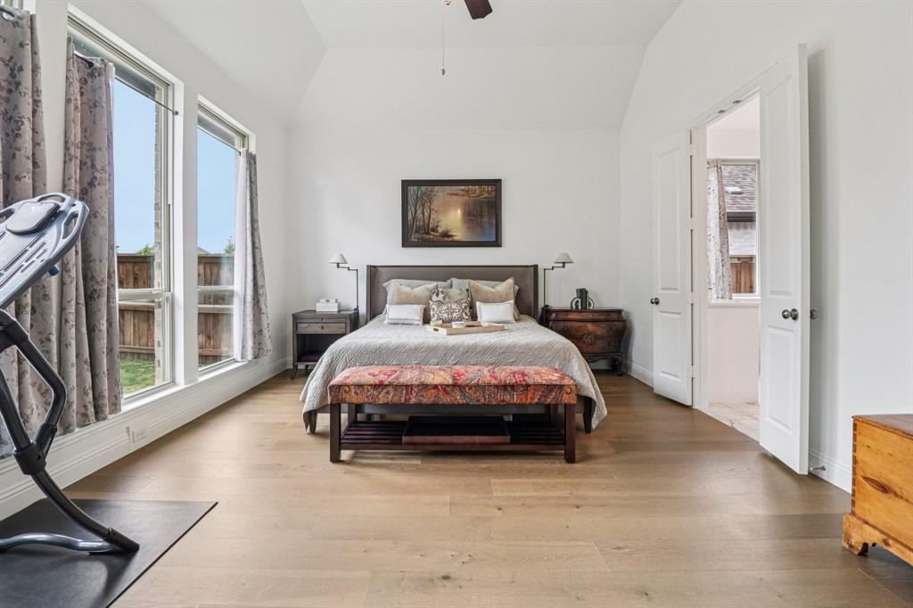 8277 Halifax The Colony, TX 75056 - Photo 13 of 37 a bedroom with a bed and wooden floor