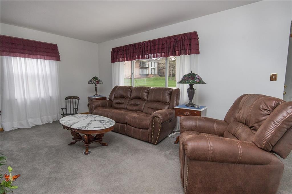 70 Darlington Road Patterson Heights, PA 15010 - Photo 3 of 20 The generous living room invites you to enjoy good conversation. Measuring approx. 13 x 22, there's ample room for furniture placement with the fireplace as a focal point. You'll appreciate the abundant natural light!