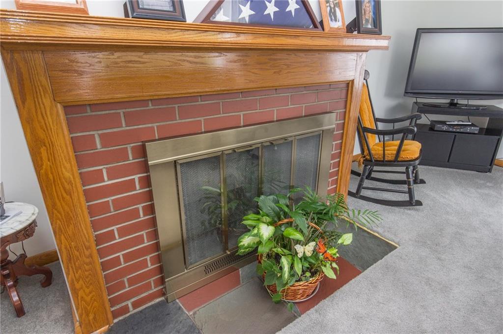 70 Darlington Road Patterson Heights, PA 15010 - Photo 5 of 20 Warm solid wood trim and mantle surround the wood-burning fireplace at 70 Darlington Rd., Patterson Heights!