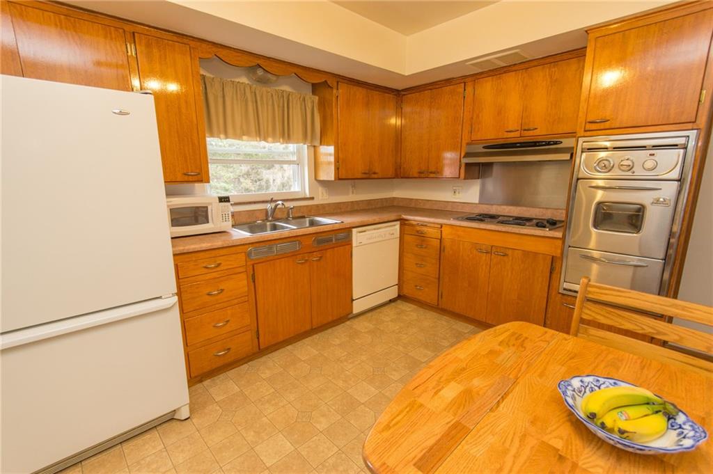 70 Darlington Road Patterson Heights, PA 15010 - Photo 6 of 20 A delightful kitchen has natural light from all angles! Prep work is a pleasure with a view of the outdoors (Ninth Avenue). Good flow, newer flooring and true wood cabinets in excellent condition!
