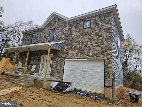 a front view of a house with parking