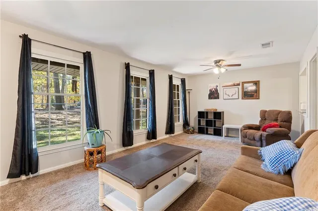 a living room with furniture and window