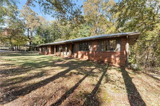 a view of backyard with large trees