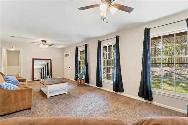 a spacious bedroom with a large bed and a window