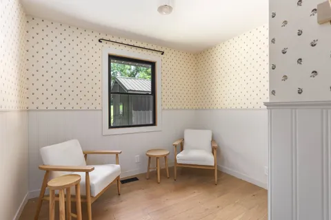 a living room with furniture and a window