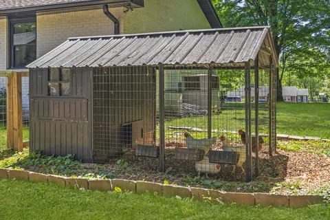 a backyard view with a seating space