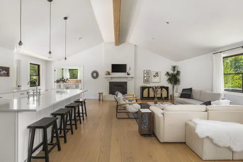 a room with fireplace furniture and a window