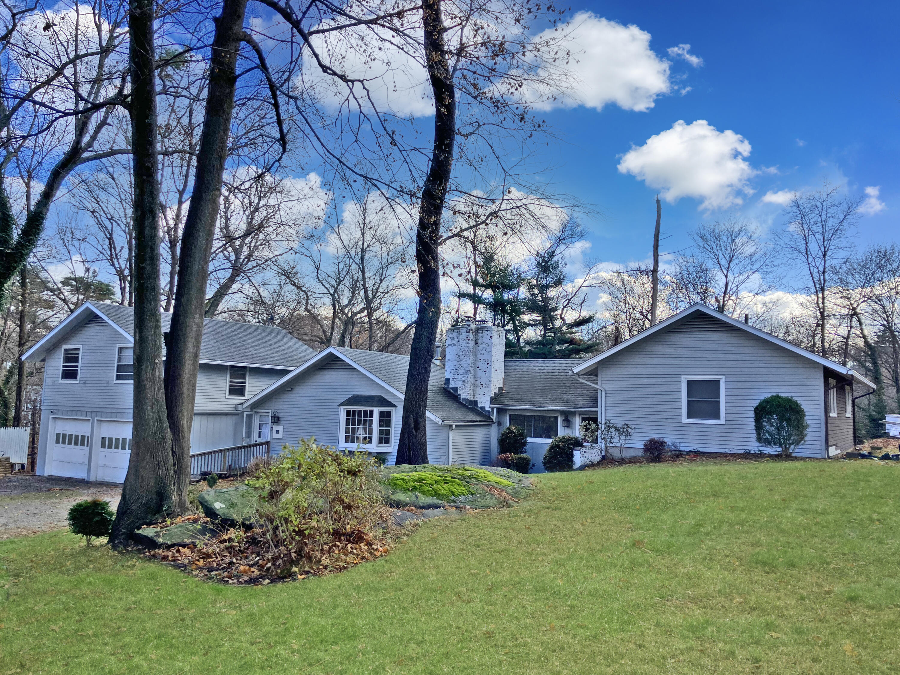 25 Goodwives River Road Darien, CT 06820 - Photo 1 of 17 a front view of a house with garden