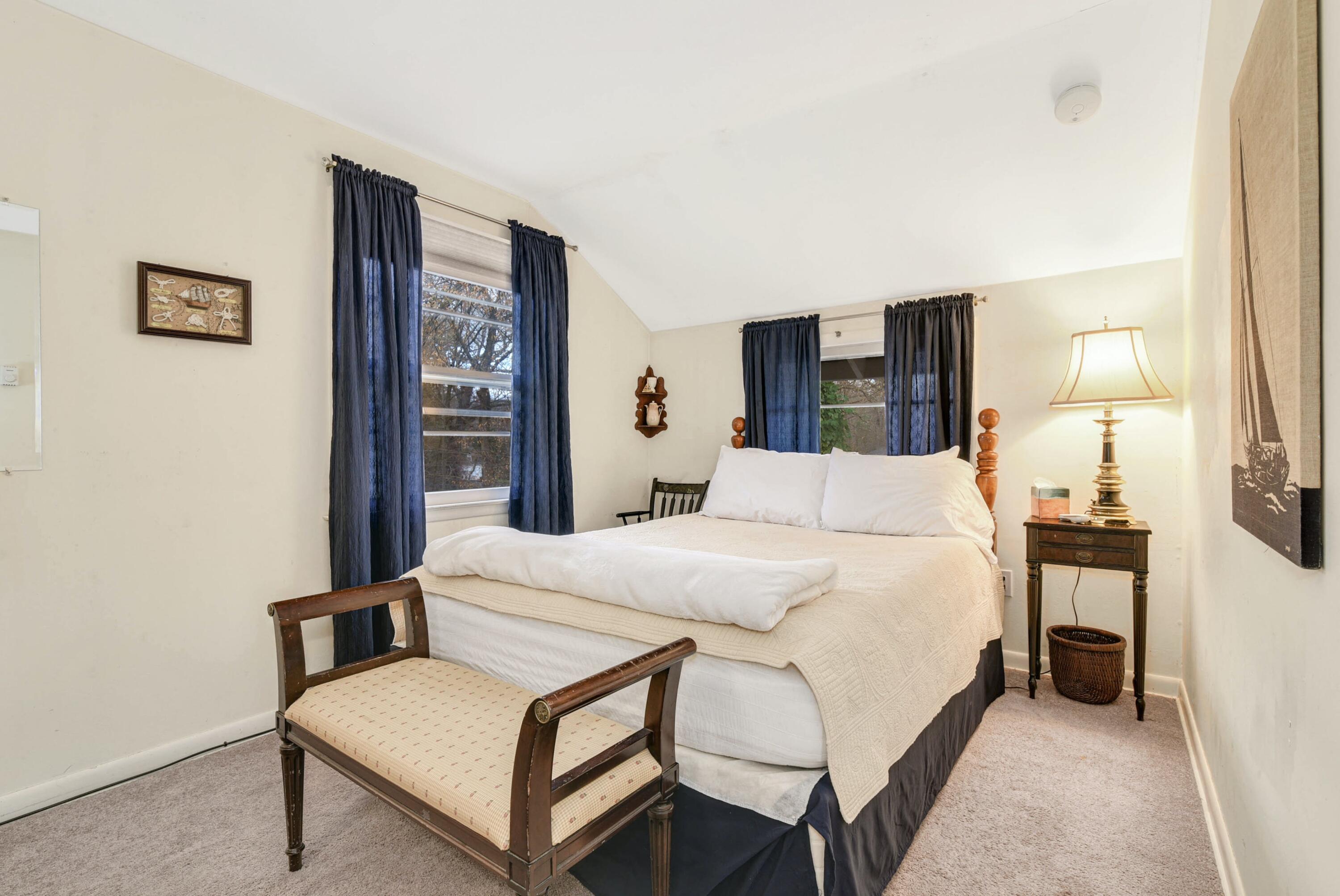 25 Goodwives River Road Darien, CT 06820 - Photo 12 of 17 a bed room with a bed and a night stand